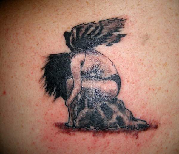 tatouage ange assis