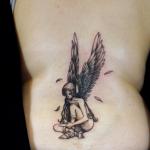 tatouage ange assis