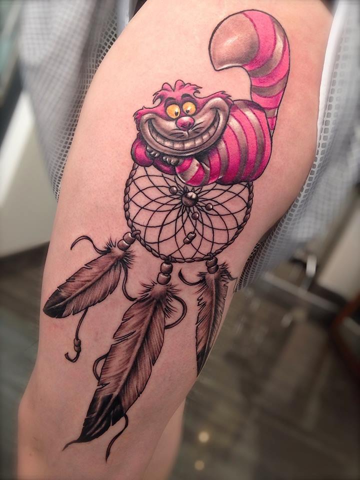 tatouage cuisse femme plume