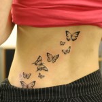 tatouage dos femme papillon