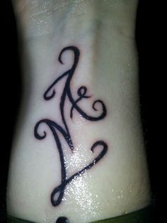 tatouage initiale ml