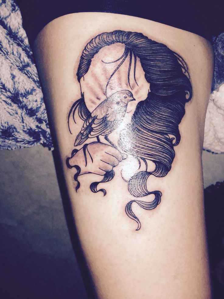 tatouage oiseau visage